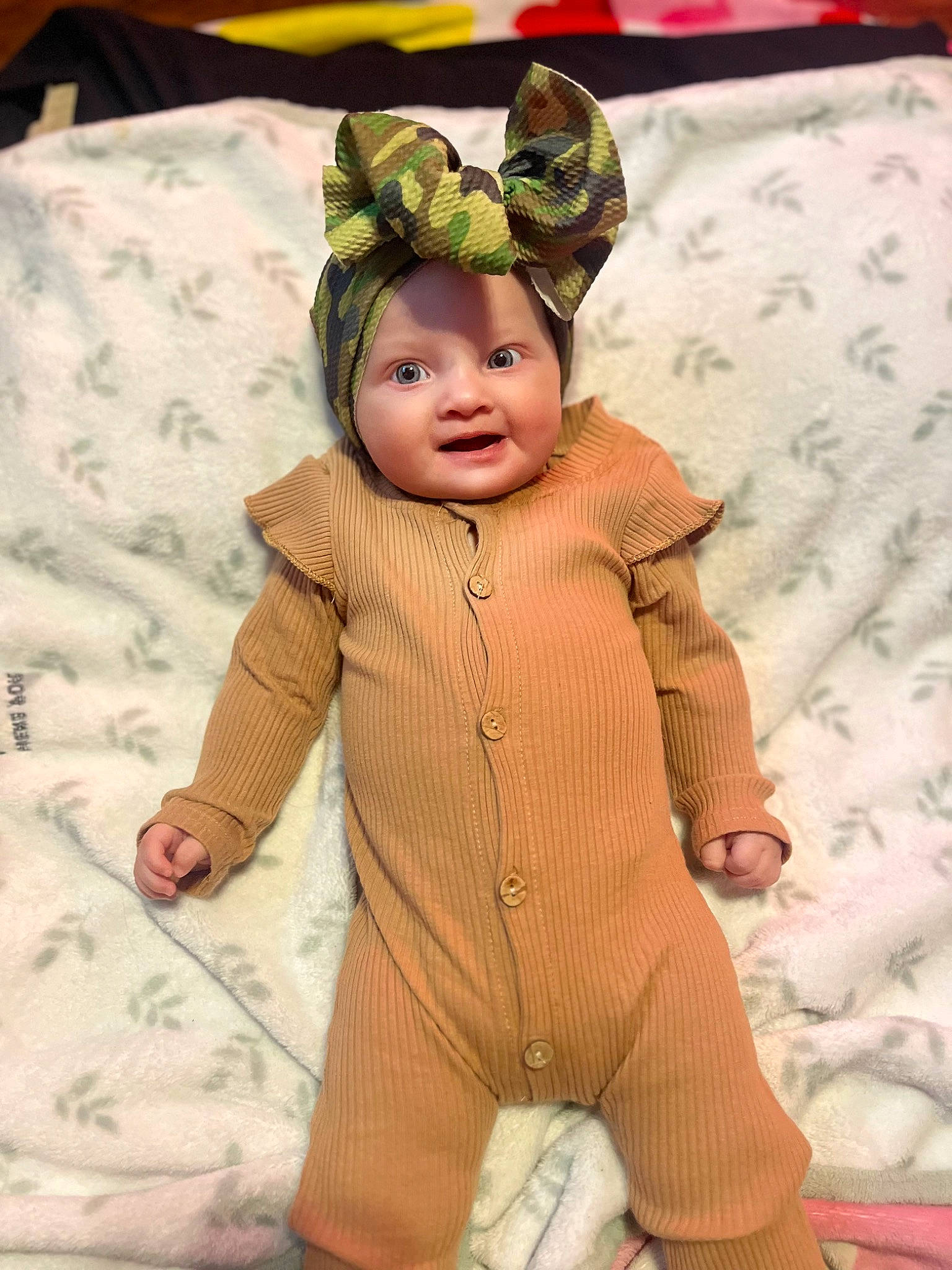 Nevaeh joined the competition — help win amazing prizes! baby, baby_products, baby_toddler_clothing, child, costume, flooring, fur, happy, headgear, headwear, linens, pattern, peach, person, personal_protective_equipment, room, skin, sleeve, smile, suit