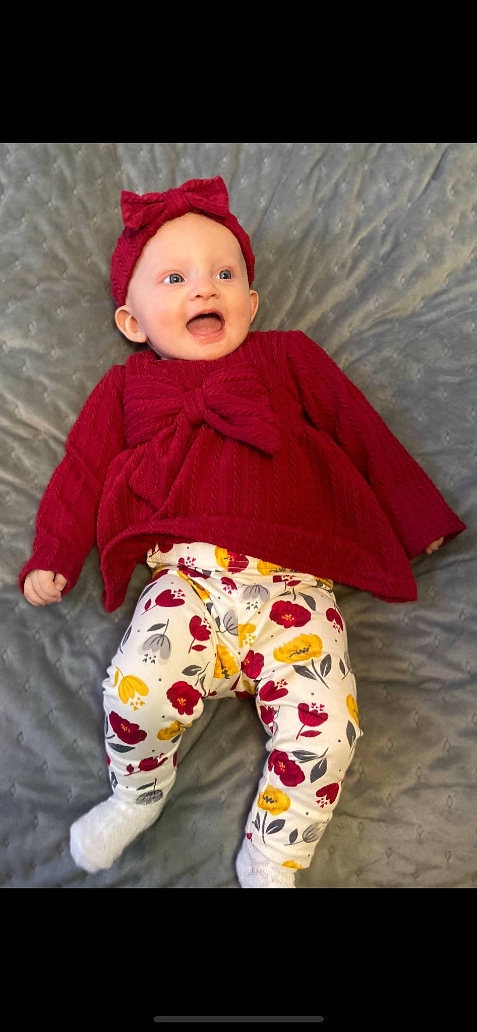 Nevaeh is registered to the contest to win money with this photo: arm, baby, baby_toddler_clothing, child, face, happy, head, human_body, leg, magenta, outerwear, pattern, person, pink, red, skin, sleeve, smile, surprise, t_shirt