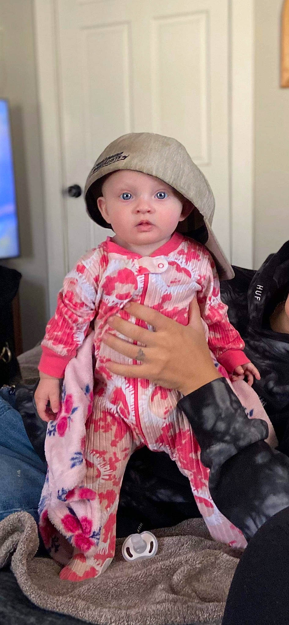 Nevaeh is registered to the contest to win money with this photo: baby, baby_toddler_clothing, cap, cheek, child, comfort, cool, eyelash, happy, head, headwear, human_leg, knee, lip, magenta, pattern, person, pink, skin, sleeve