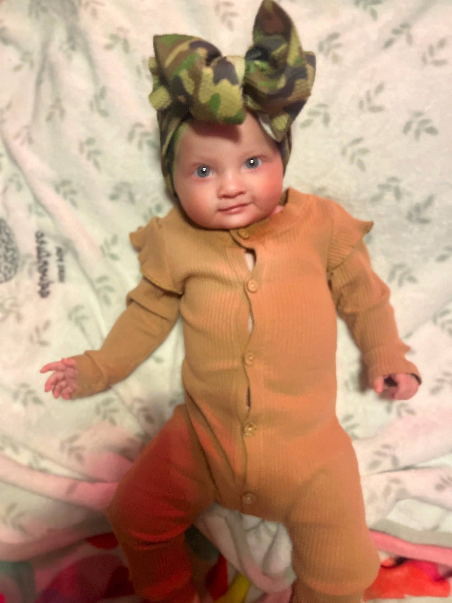 Nevaeh is registered to the contest to win money with this photo: baby, baby_toddler_clothing, child, costume_hat, doll, eye, fawn, fictional_character, fun, gesture, happy, headgear, headwear, linens, pattern, person, pink, room, sleeve, stuffed_toy