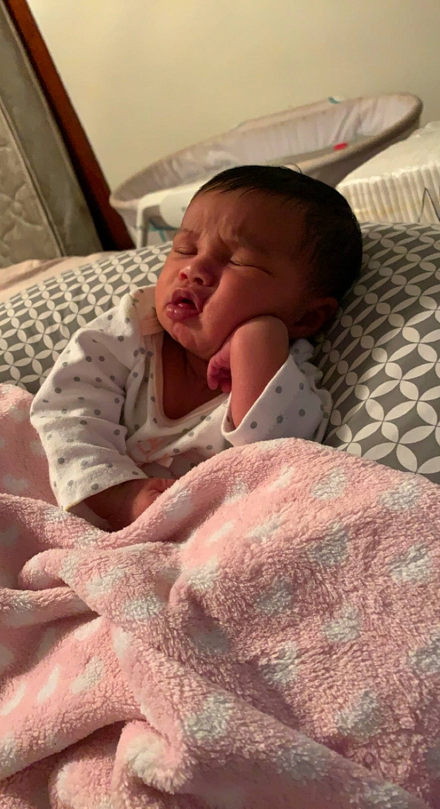 Shyanna is registered to the contest to win money with this photo: baby, baby_toddler_clothing, bed, bed_sheet, bedding, bedroom, bedtime, blanket, child, comfort, flesh, linens, mouth, pattern, person, room, skin, sleeve, textile, thumb