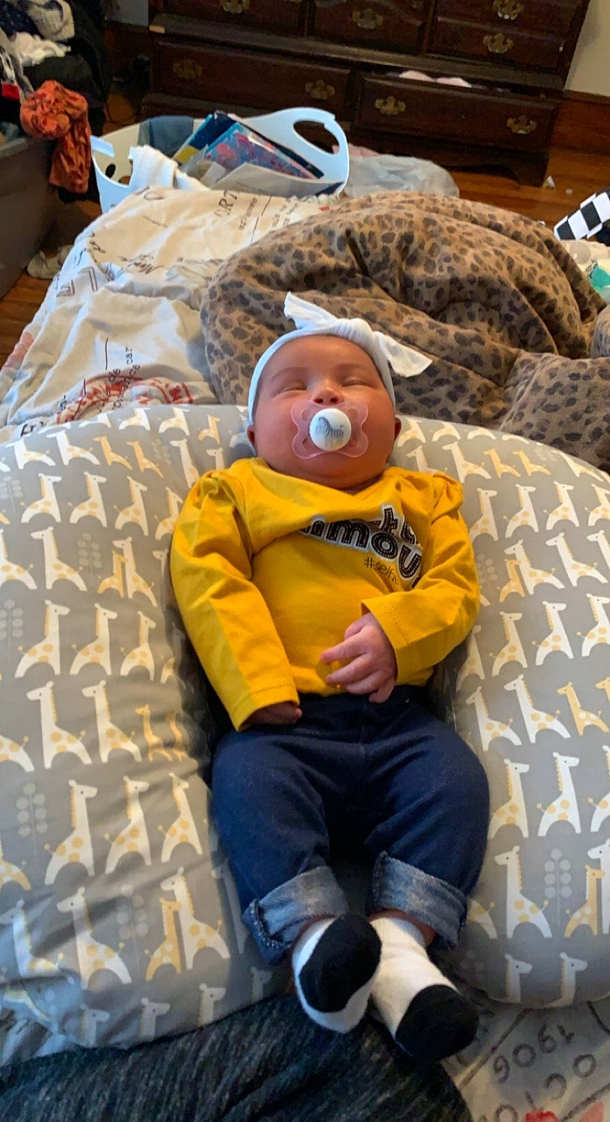 Shyanna is registered to the contest to win money with this photo: baby, baby_products, baby_toys, bedtime, child, comfort, couch, flooring, fun, hat, head, leisure, linens, person, room, shorts, sitting, stuffed_toy, toddler, toy