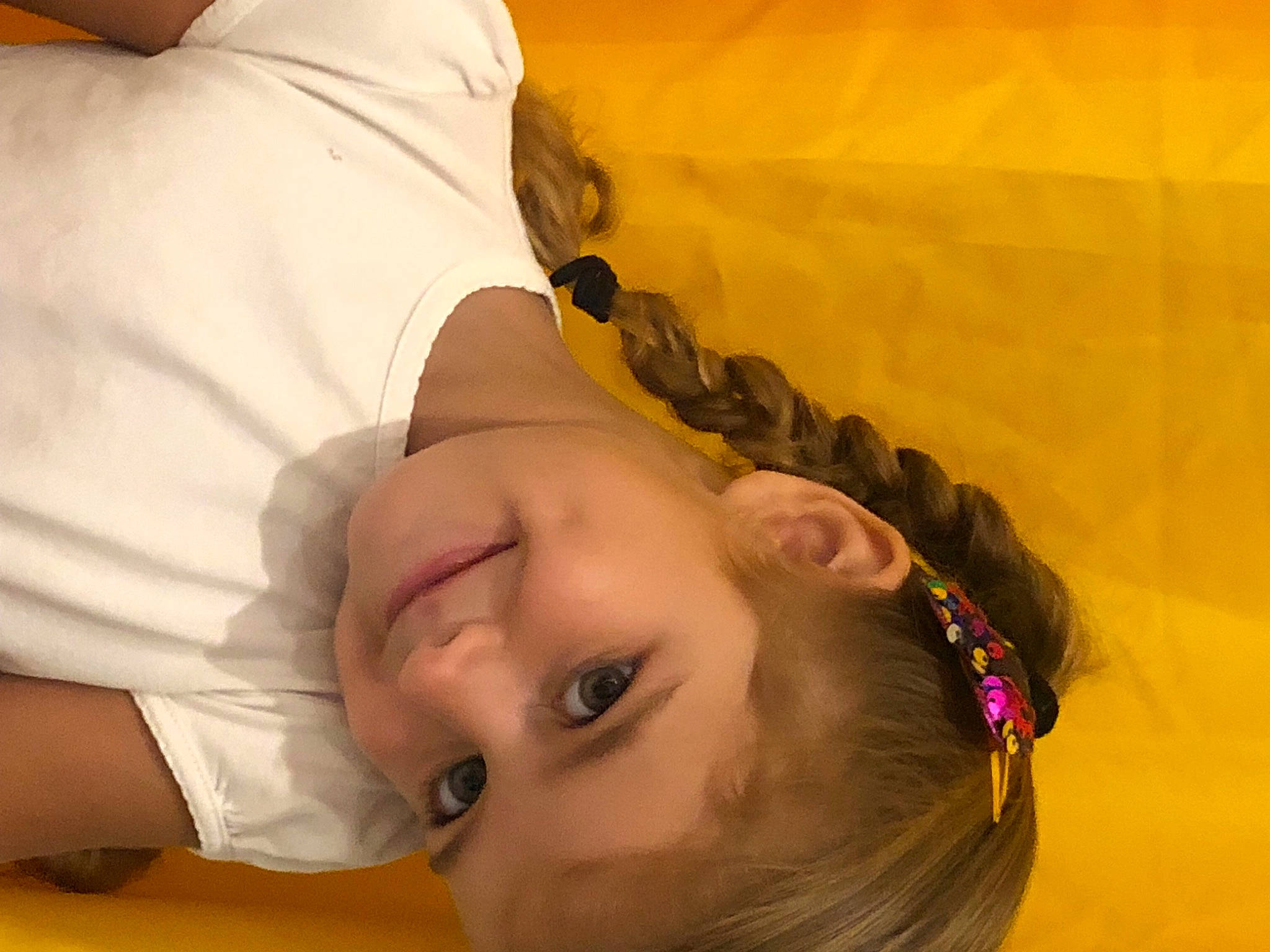 Lily participe au concours pour gagner de l'argent avec cette photo : child, chin, comfort, elbow, eyebrow, eyelash, fashion_accessory, fun, happy, joy, leisure, nose, orange, pattern, person, toddler, yellow