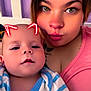 Noah joined the competition — help win amazing prizes! baby, woman, selfie, cat_ears_filter, face, portrait, indoor, striped_clothing, pink_shirt, tattoo, skin, closeup, fun_filter, neon_effect, child, cute, smiling, person, head, family