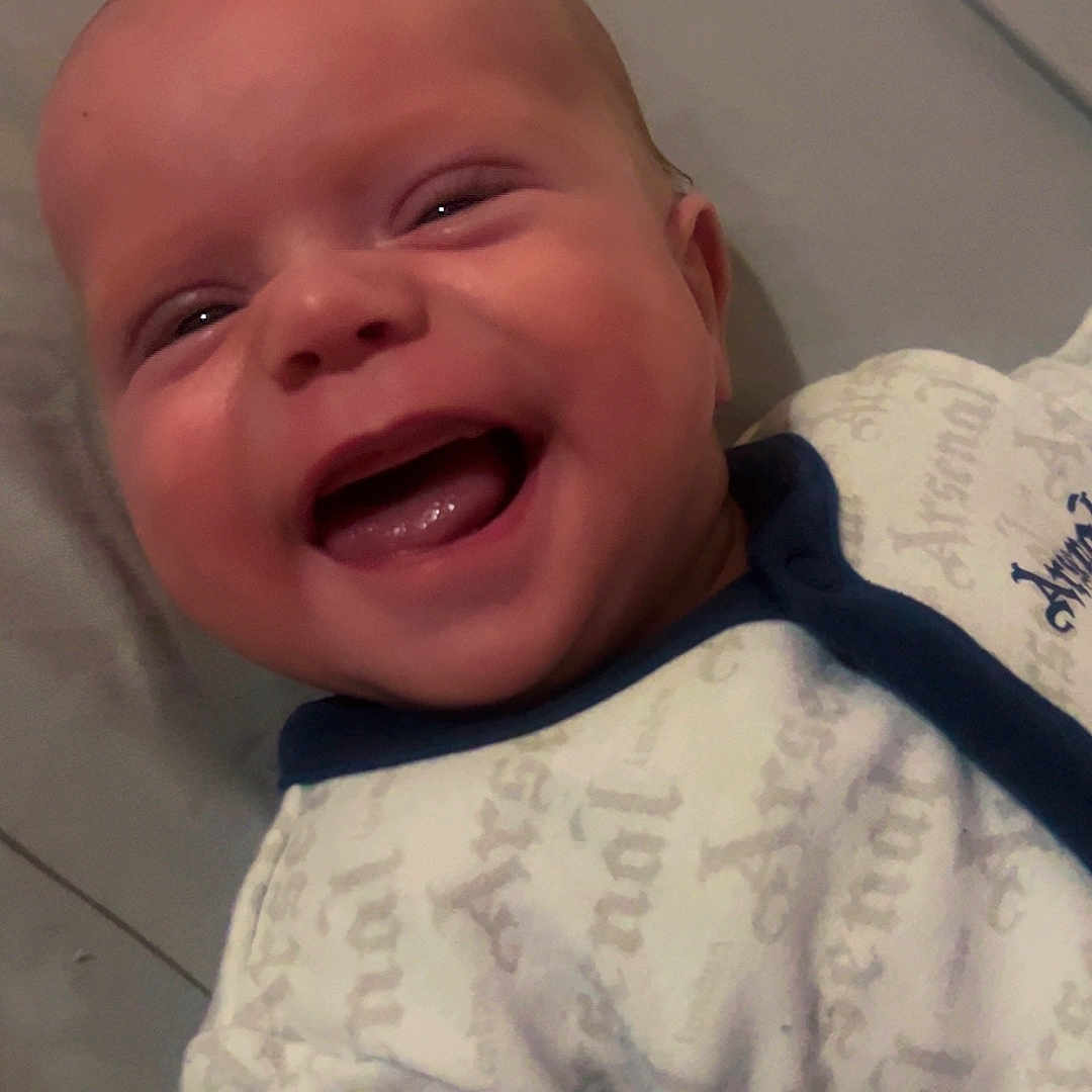 Noah is registered to the contest to win money with this photo: baby, babywear, child, closeup, clothing, cute, expression, eyes, face, happy, head, human, infant, joy, lying, mouth, newborn, portrait, skin, smiling