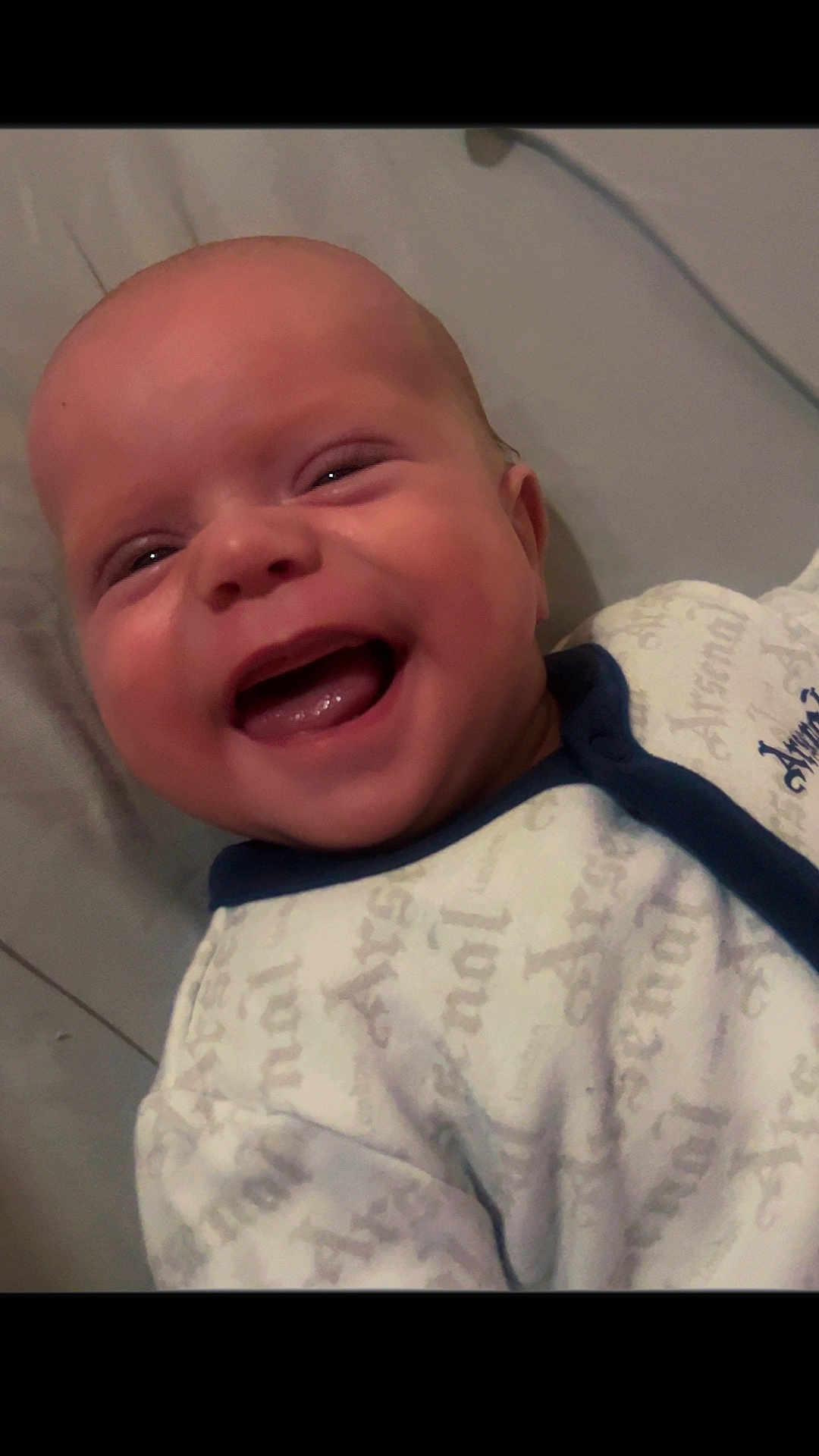 Noah is registered to the contest to win money with this photo: baby, smiling, face, infant, clothing, happy, portrait, closeup, cute, newborn, child, human, skin, mouth, eyes, head, babywear, lying, expression, joy