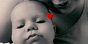 Noah is registered to the contest to win money with this photo: baby, adult, black_and_white, portrait, close_up, face, smile, love, heart_sticker, skin, person, head, eyes, cheek, clothing, bonding, candid, affection, indoor, family