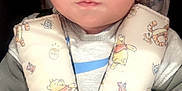 Noah is registered to the contest to win money with this photo: baby, infant, car_seat, harness, blanket, winnie_the_pooh, child, seat_belt, cute, face, clothing, sweater, closeup, car, seat, safety, child_safety, expression, indoor, young