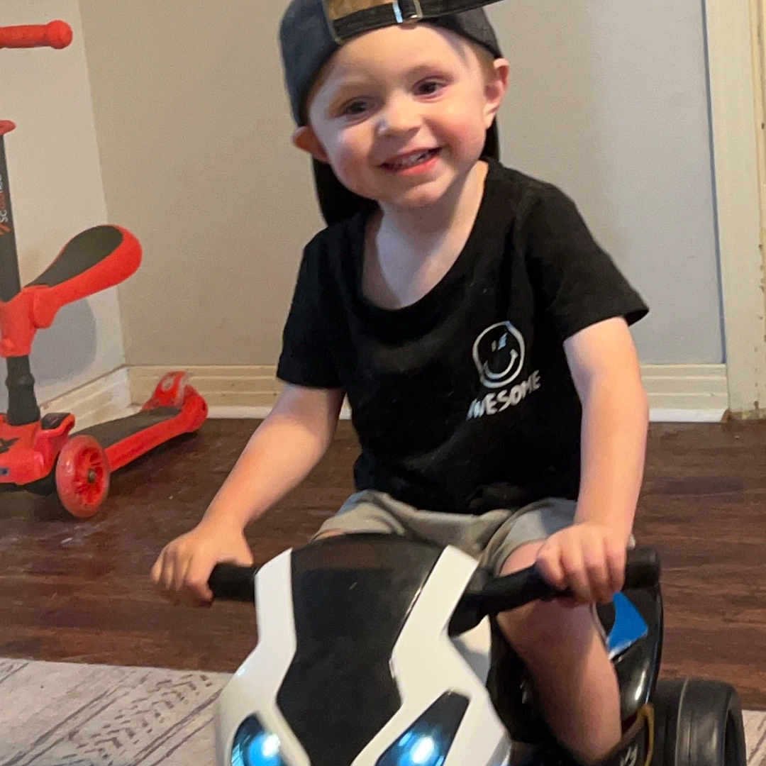 Oakley joined the competition — help win amazing prizes! boy, cap, child, clothing, face, footwear, hat, head, helmet, machine, male, motorcycle, person, photography, portrait, shoe, sitting, transportation, vehicle, wheel