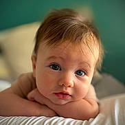Elliot participe au concours pour gagner de l'argent avec cette photo : baby, infant, face, eyes, hair, skin, resting, soft, white, bed, curious, portrait, closeup, child, cute, expression, indoors, young, peaceful, background