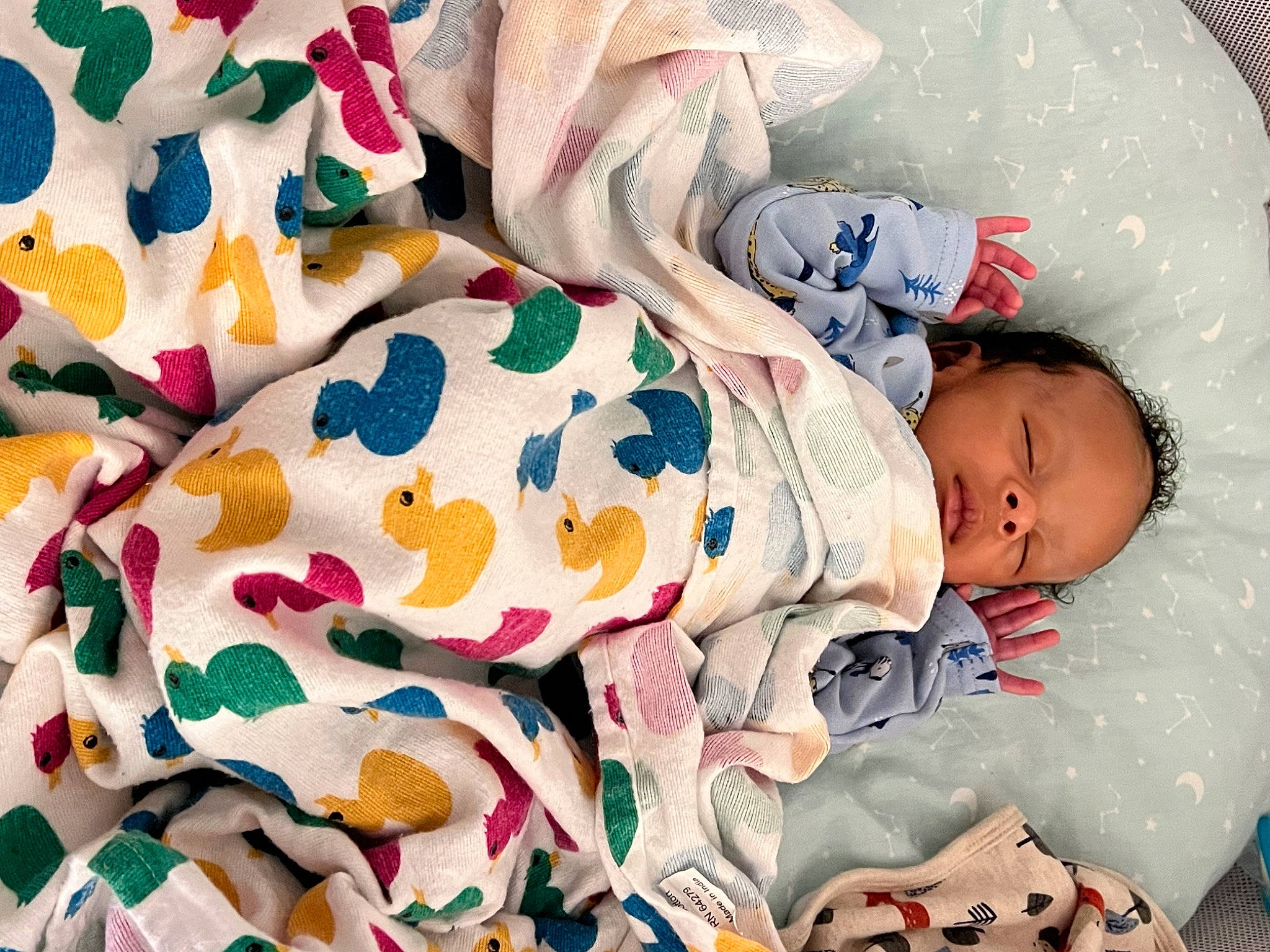 Kareem joined the competition — help win amazing prizes! baby, baby_products, baby_safety, baby_sleeping, baby_toddler_clothing, baby_toys, bedding, bedtime, child, comfort, facial_expression, linens, nap, pattern, person, room, skin, sleep, sleeve, textile