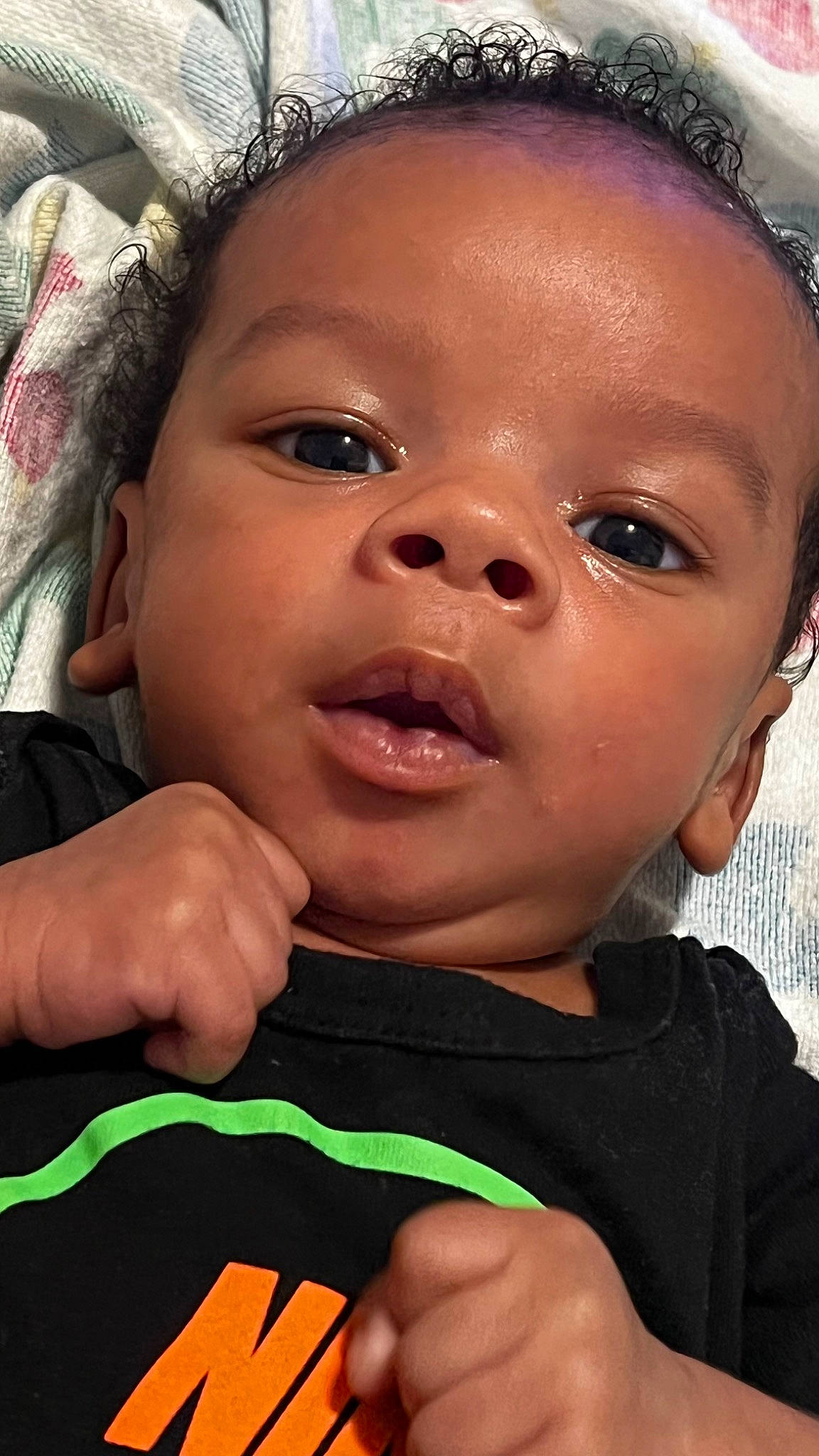 Kareem is registered to the contest to win money with this photo: baby, black, cheek, chin, cool, ear, eyebrow, eyelash, facial_expression, finger, forehead, gesture, hairstyle, happy, iris, lip, mouth, nose, person, skin