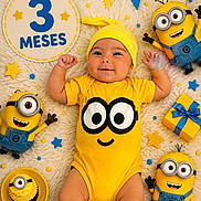 Alan joined the competition — help win amazing prizes! baby, infant, yellow_clothing, minion_toys, cupcake, birthday_decorations, blue_and_yellow, smiling, laying_down, celebration, hat, soft_blanket, cute, child, festive, toy, gift_box, colorful, happy, portrait