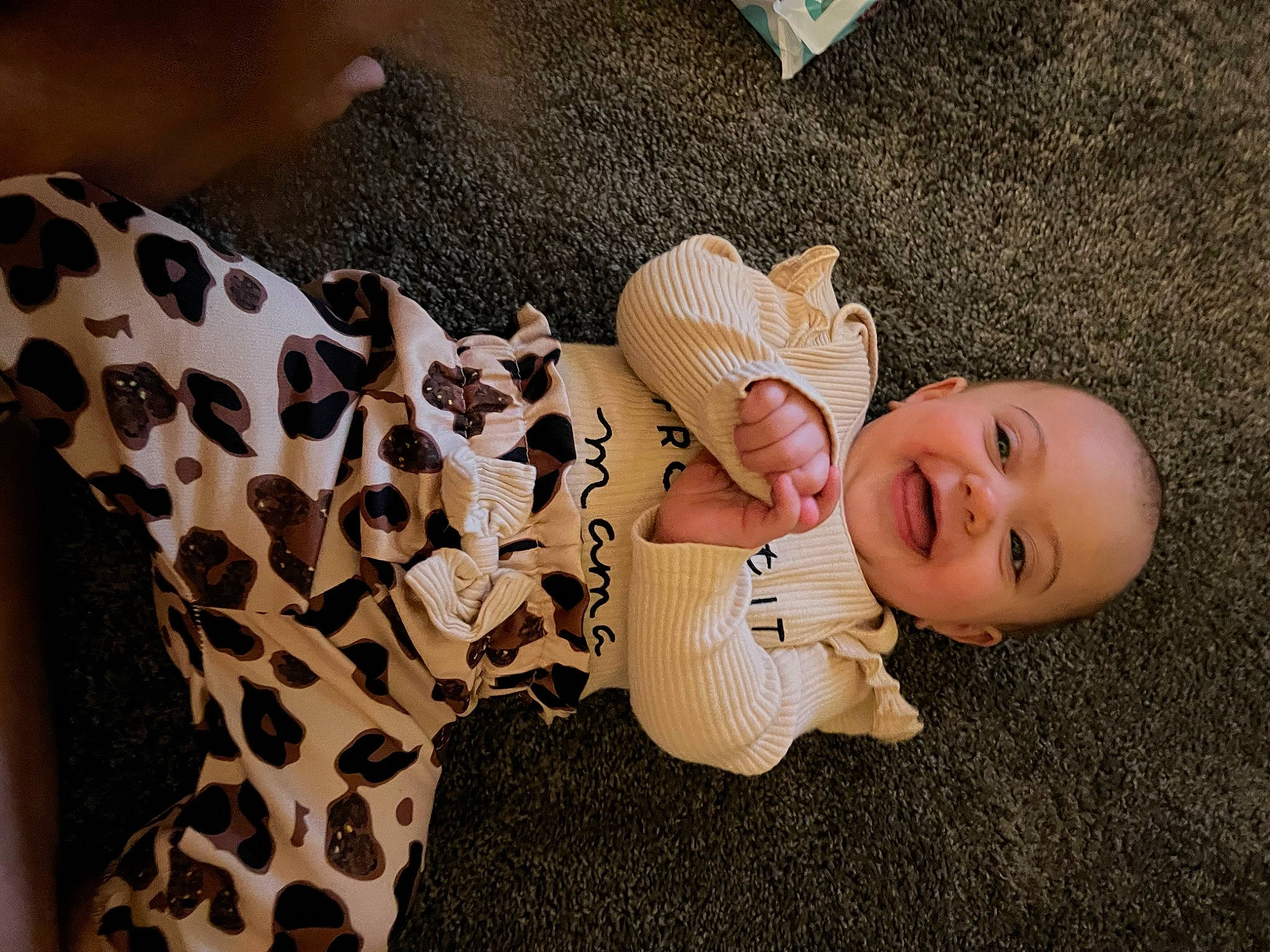Scarlett is registered to the contest to win money with this photo: baby, baby_toddler_clothing, comfort, doll, fawn, finger, flooring, happy, headgear, human_leg, joint, joy, mammal, person, skin, sleeve, smile, stuffed_toy, textile, toy