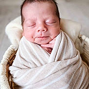 Zaiden joined the competition — help win amazing prizes! newborn, baby, sleeping, wrapped, blanket, beige, striped, basket, cozy, peaceful, infant, cute, soft, portrait, closeup, hands, face, resting, indoor, warm