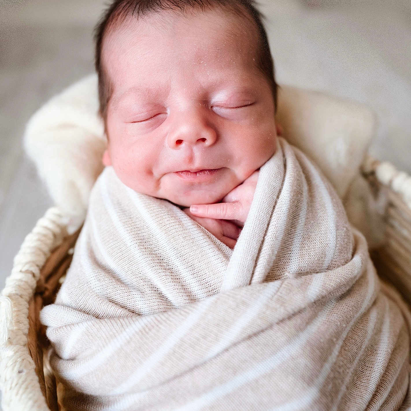Zaiden joined the competition — help win amazing prizes! baby, basket, beige, blanket, closeup, cozy, cute, face, hands, indoor, infant, newborn, peaceful, portrait, resting, sleeping, soft, striped, warm, wrapped