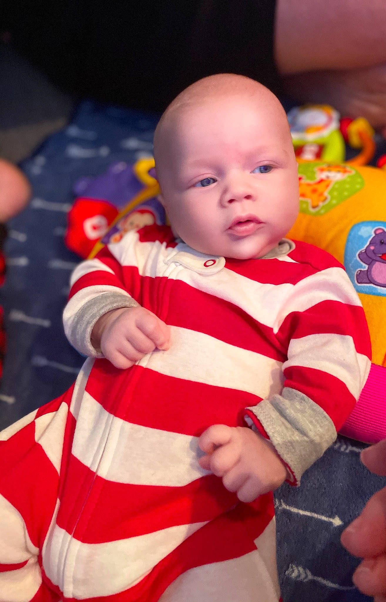 Cade is registered to the contest to win money with this photo: baby, baby_products, baby_toddler_clothing, baby_toys, cheek, child, finger, nail, person, product, skin, sock, stomach, thumb, toddler