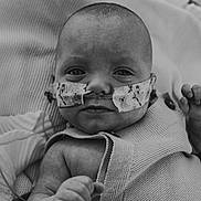 Braxton joined the competition — help win amazing prizes! baby, infant, nasal_tube, medical_tape, blanket, knitted, black_and_white, close_up, face, expression, hospital, patient, tubing, child, portrait, newborn, vulnerability, wrapped, hand, lying_down