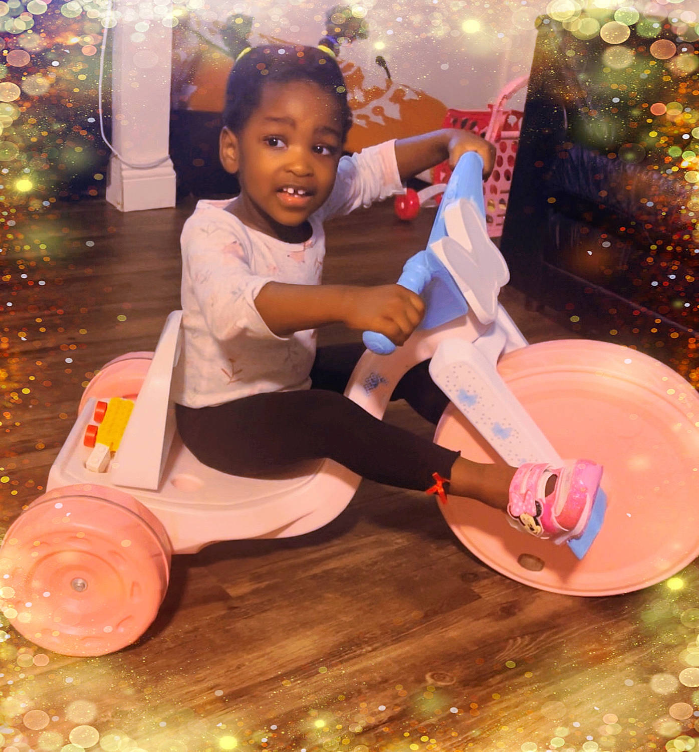 Shantal joined the competition — help win amazing prizes! automotive_wheel_system, baby_toddler_clothing, child, christmas_tree, circle, event, fun, happy, leisure, magenta, person, play, recreation, riding_toy, sitting, smile, tire, toddler, tree, vehicle
