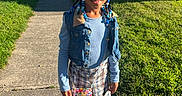 Khrystlyn is registered to the contest to win money with this photo: child, girl, smiling, portrait, outdoor, sidewalk, neighborhood, residential, sunlight, grass, houses, denim, plaid, skirt, sandals, braids, hair_beads, blue_clothing, fashion, standing