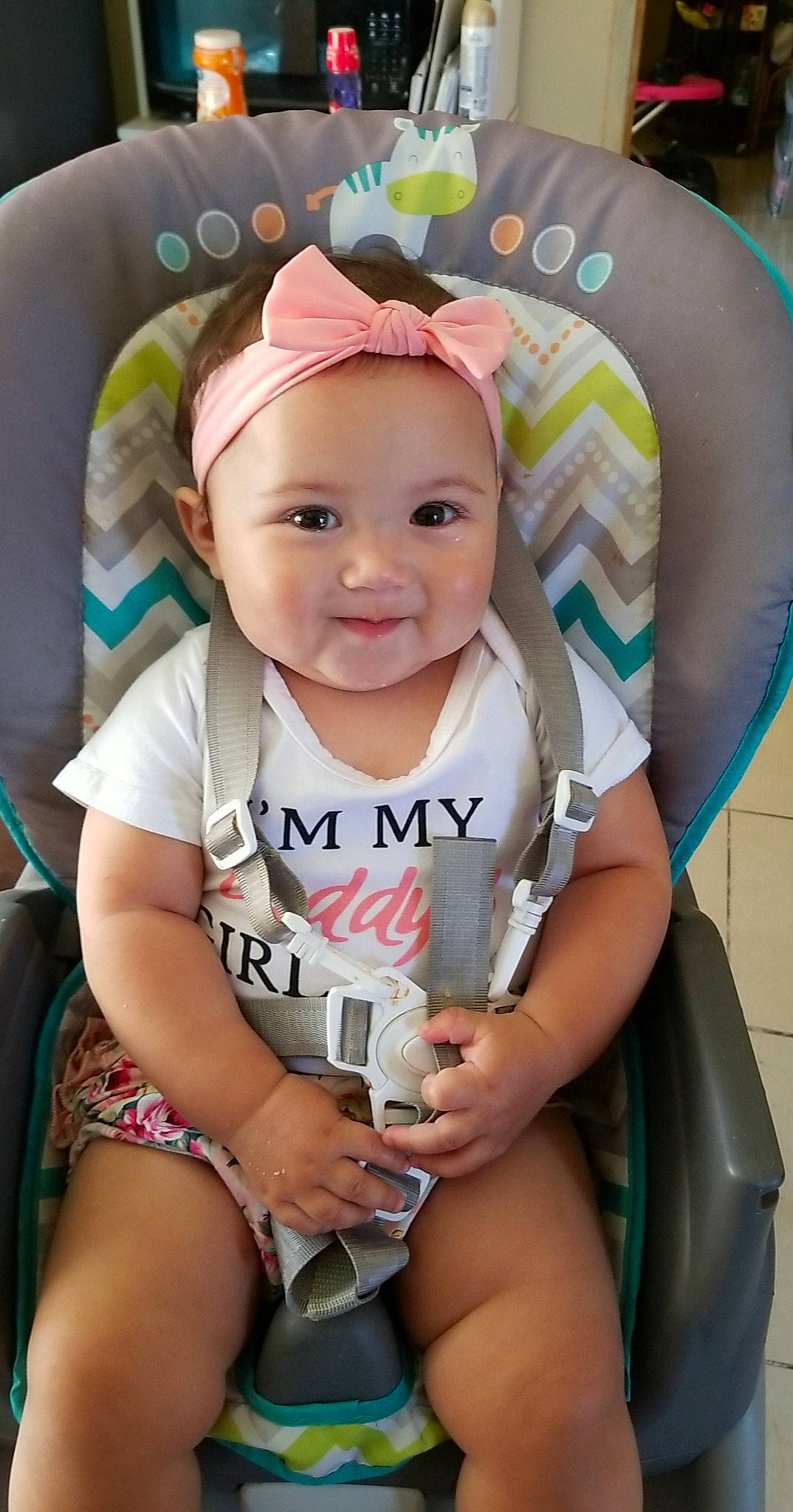 Angelena is registered to the contest to win money with this photo: baby, baby_toddler_clothing, cap, cheek, child, comfort, eye, fashion_accessory, finger, fun, happy, headband, headwear, iris, joy, person, pink, sitting, skin, smile