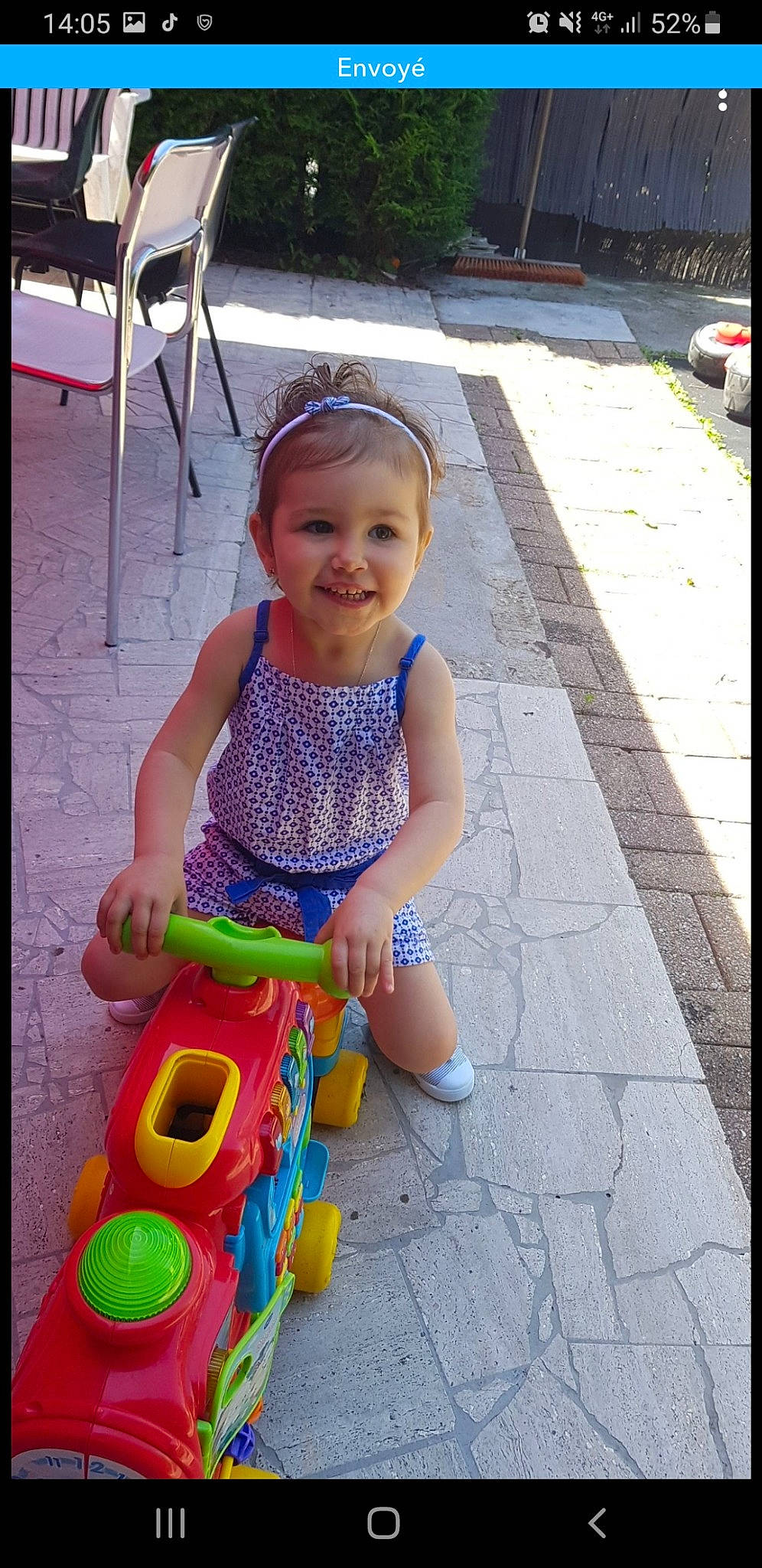 Lou participe au concours pour gagner de l'argent avec cette photo : baby_toddler_clothing, beauty, child, fun, happy, joy, leisure, person, photograph, pink, product, public_space, purple, recreation, riding_toy, road_surface, smile, snapshot, summer, toddler