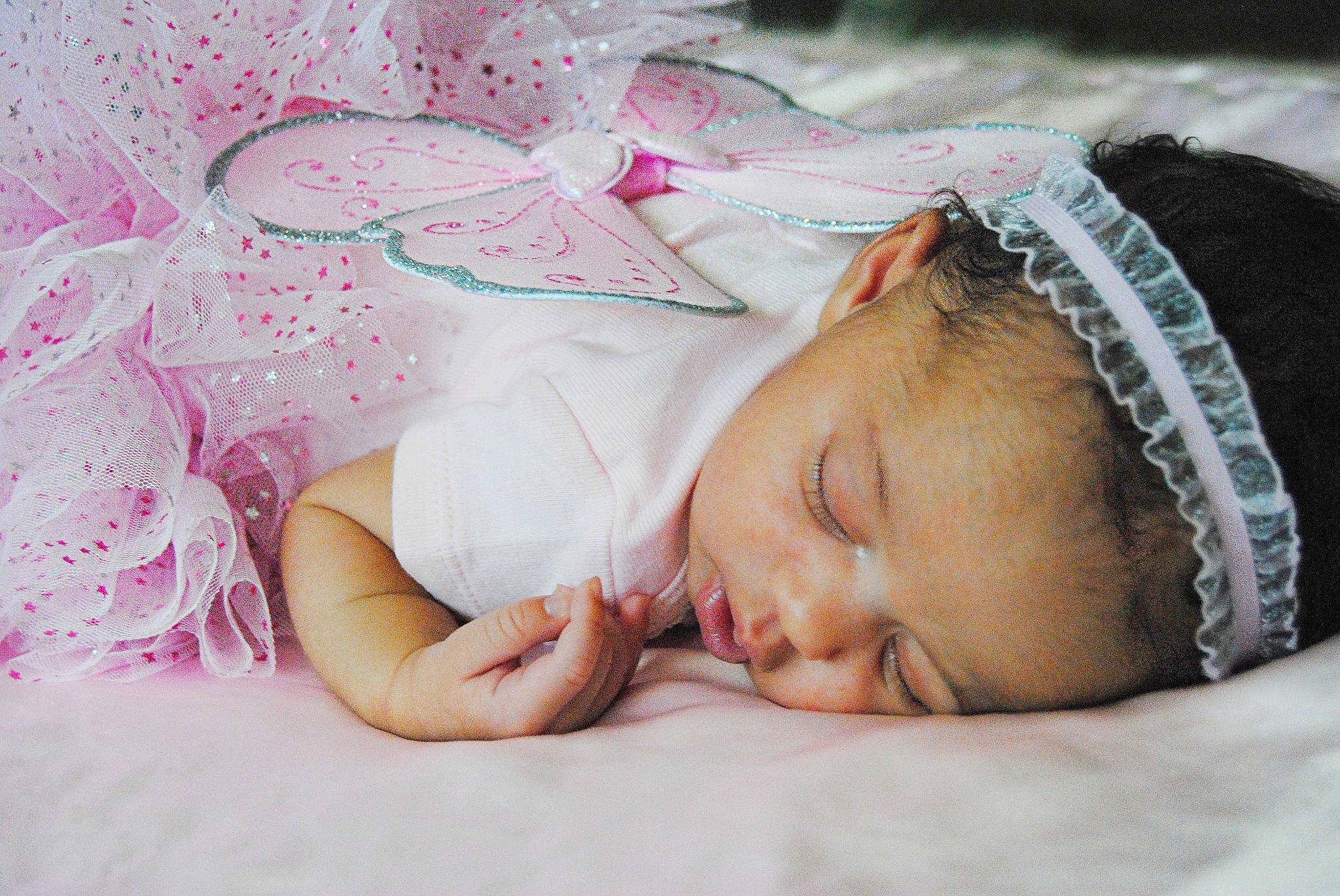 Lilyana is registered to the contest to win money with this photo: baby, baby_sleeping, bedtime, birth, cheek, child, fashion_accessory, hair_accessory, hand, headband, headgear, headpiece, nap, person, photograph, photography, pink, skin, sleep, textile