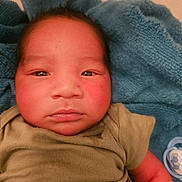 Sejong joined the competition — help win amazing prizes! baby, infant, face, child, towel, clothing, pacifier, close_up, portrait, skin, newborn, lying_down, green_clothing, blue_towel, soft_texture, rosy_cheeks, indoors, person, human, cute