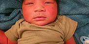 Sejong joined the competition — help win amazing prizes! baby, infant, towel, clothing, green_onesie, pacifier, face, skin, newborn, person, portrait, indoors, cute, small, resting, lying_down, human, child, soft, warm