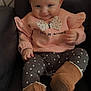 baby, child, bow, pink_bow, sweater, butterfly, polka_dot_leggings, boots, brown_boots, smile, face, eyes, chair, indoor, cute, fashion, toddler, happy, portrait, cozy