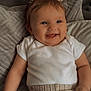 Ariella joined the competition — help win amazing prizes! baby, smiling, pigtails, pink_bows, white_shirt, knitted_pants, couch, pillows, indoor, child, cute, happy, infant, portrait, person, cozy, relaxed, small_hands, blue_eyes, soft_lighting