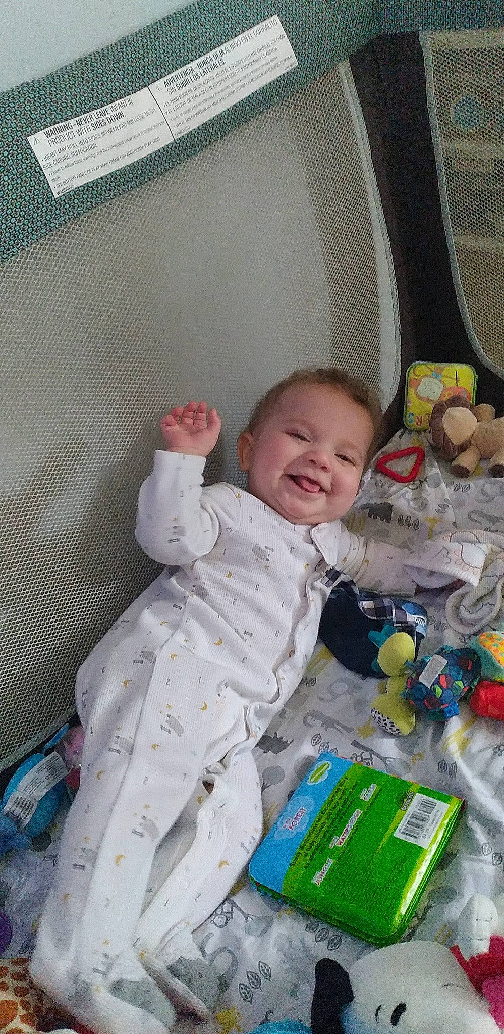 Jericho is registered to the contest to win money with this photo: baby, baby_products, baby_toddler_clothing, baby_toys, cheek, child, comfort, flooring, fun, happy, infant_bed, joy, linens, person, plastic, play, product, room, sitting, sleeve