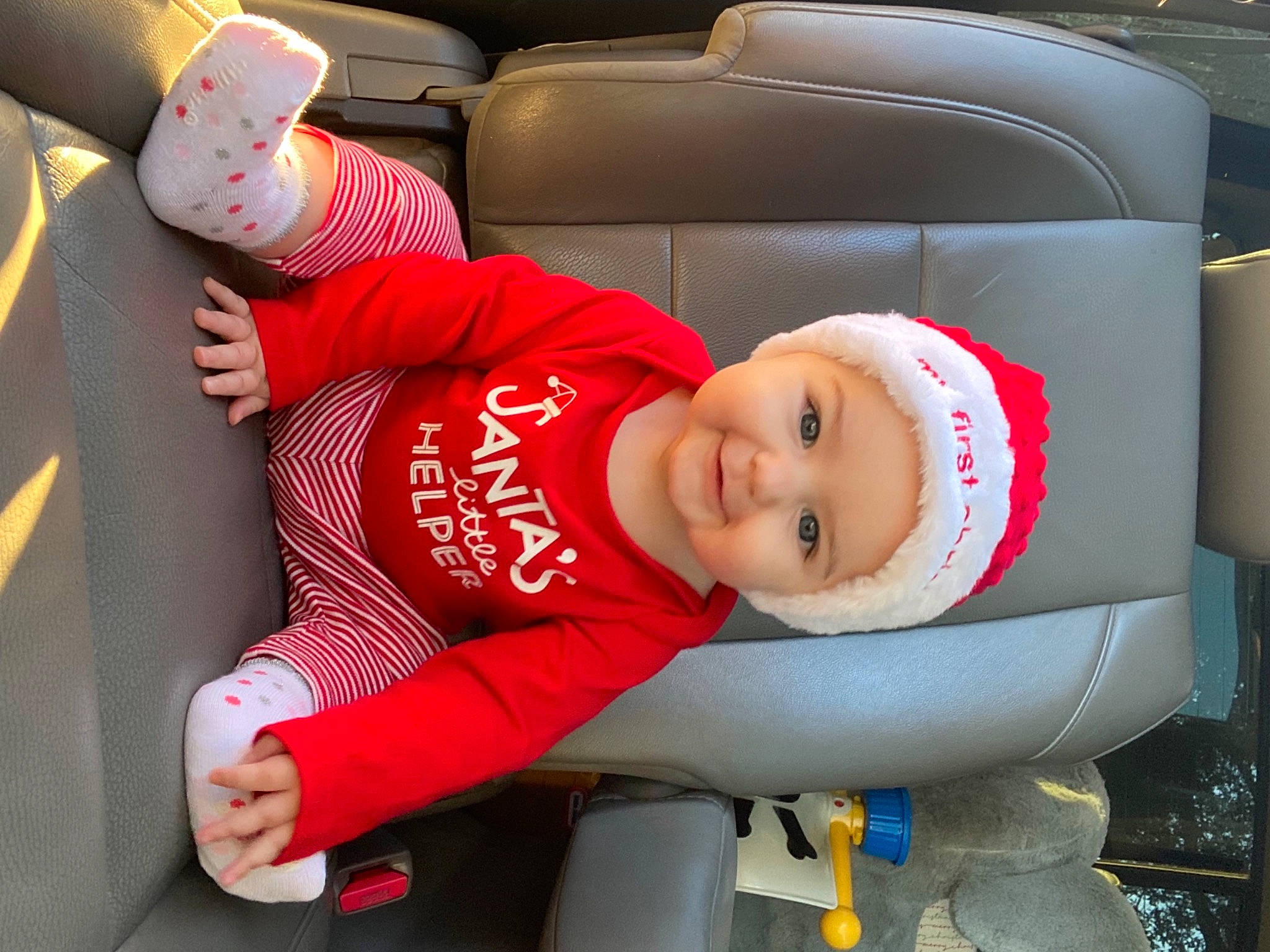 Skylar is registered to the contest to win money with this photo: auto_part, automotive_design, baby, baby_carriage, baby_toddler_clothing, car_seat, child, comfort, couch, fun, hand, hat, headwear, human_leg, joy, lap, person, sleeve, smile, snapshot