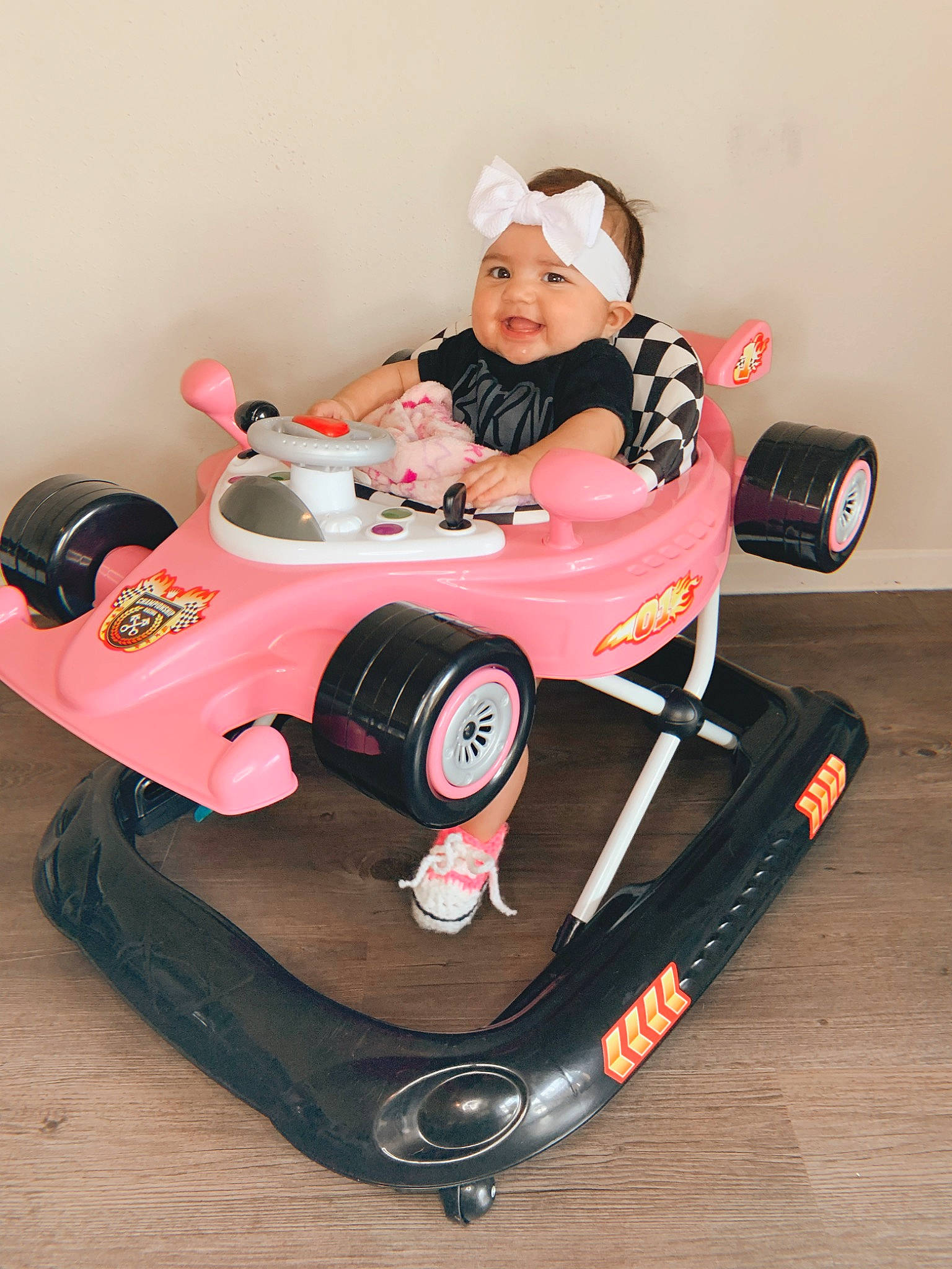Aribella is registered to the contest to win money with this photo: auto_part, automotive_design, automotive_exterior, baby, baby_products, bumper, carmine, child, happy, headwear, motor_vehicle, person, product, recreation, riding_toy, sports, tire, toddler, toy, toy_vehicle