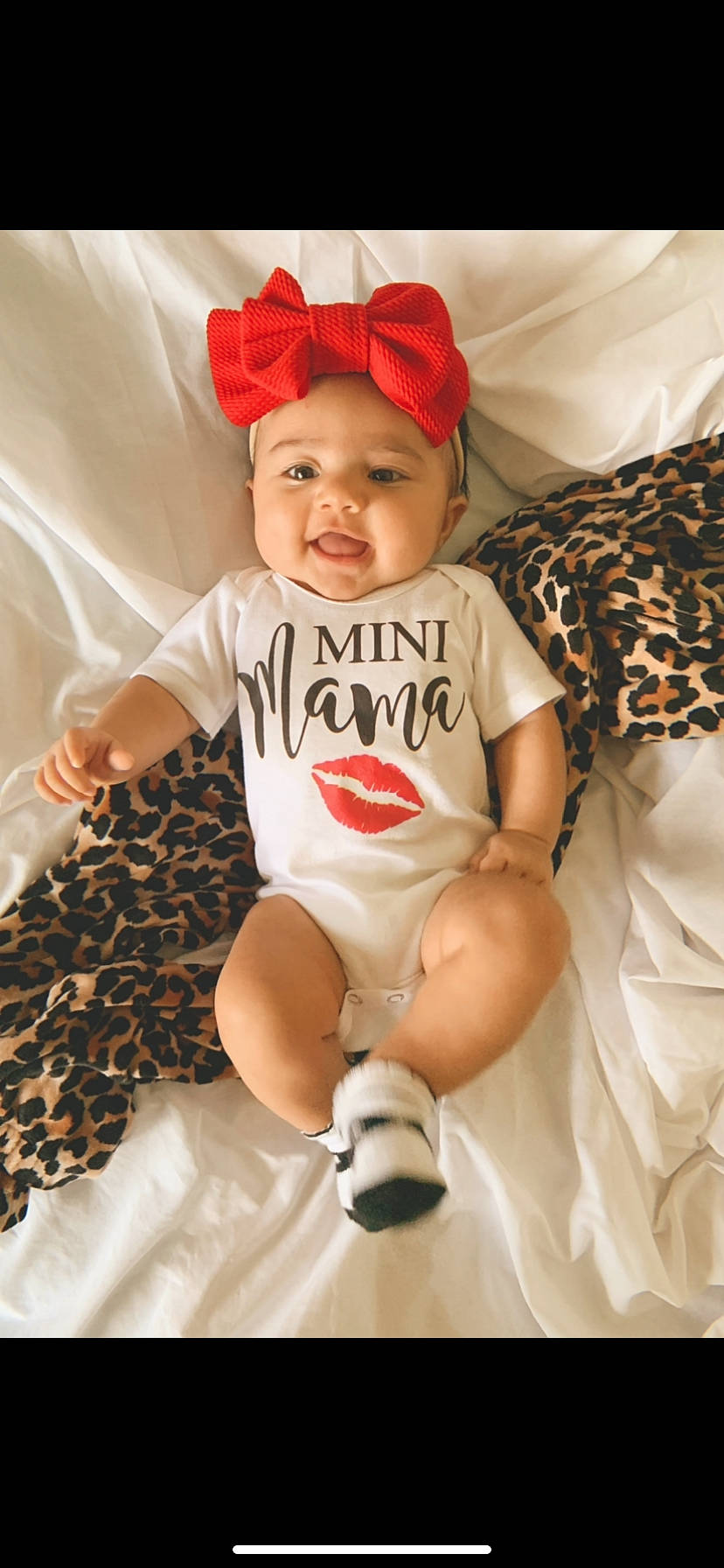 Aribella is registered to the contest to win money with this photo: baby, baby_toddler_clothing, cool, eye, face, facial_expression, fun, happy, head, headwear, human, mammal, person, pink, product, skin, sleeve, smile, textile, thigh