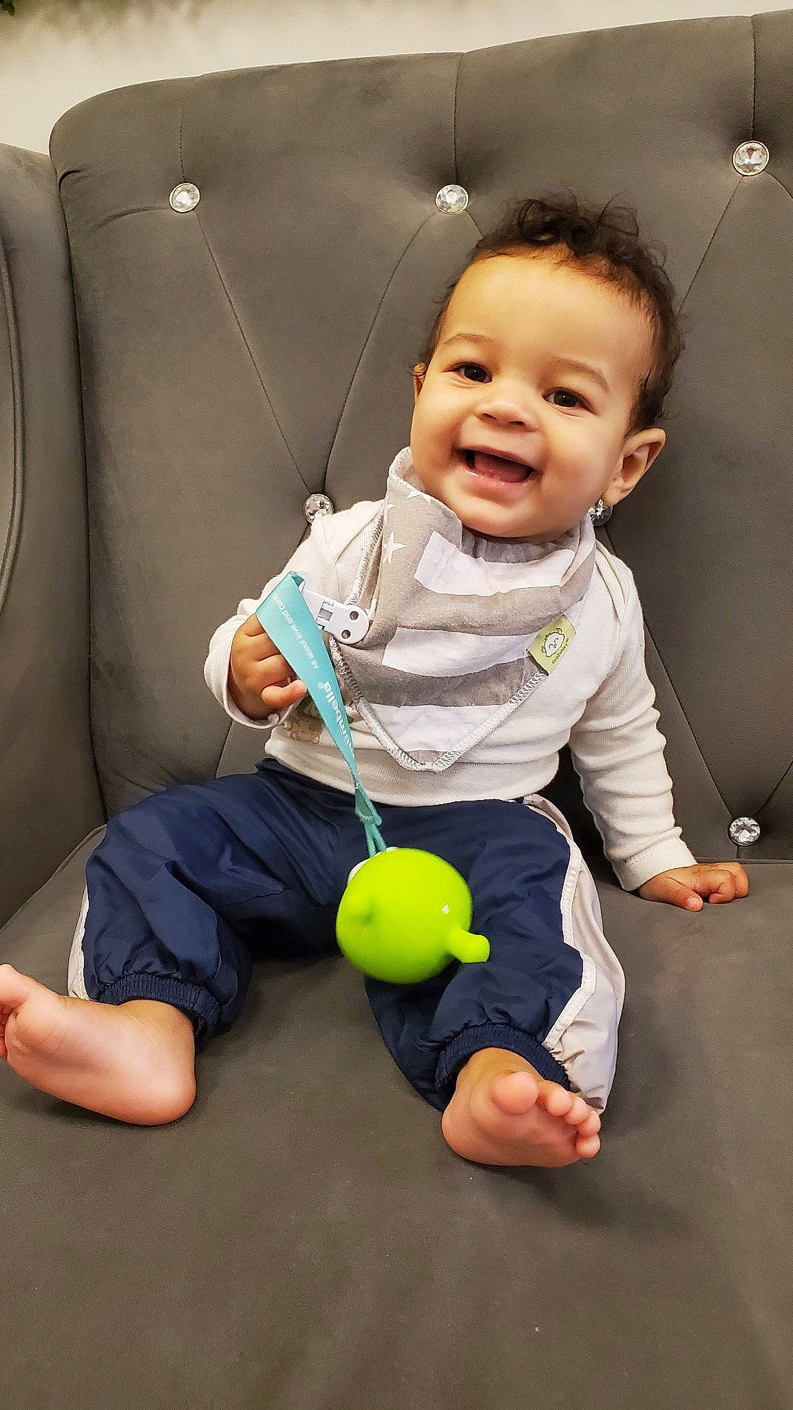 Jiraiya is registered to the contest to win money with this photo: arm, baby, baby_products, baby_toddler_clothing, child, comfort, flash_photography, flooring, fun, hand, happy, joy, knee, leisure, person, sitting, skin, sleeve, smile, t_shirt