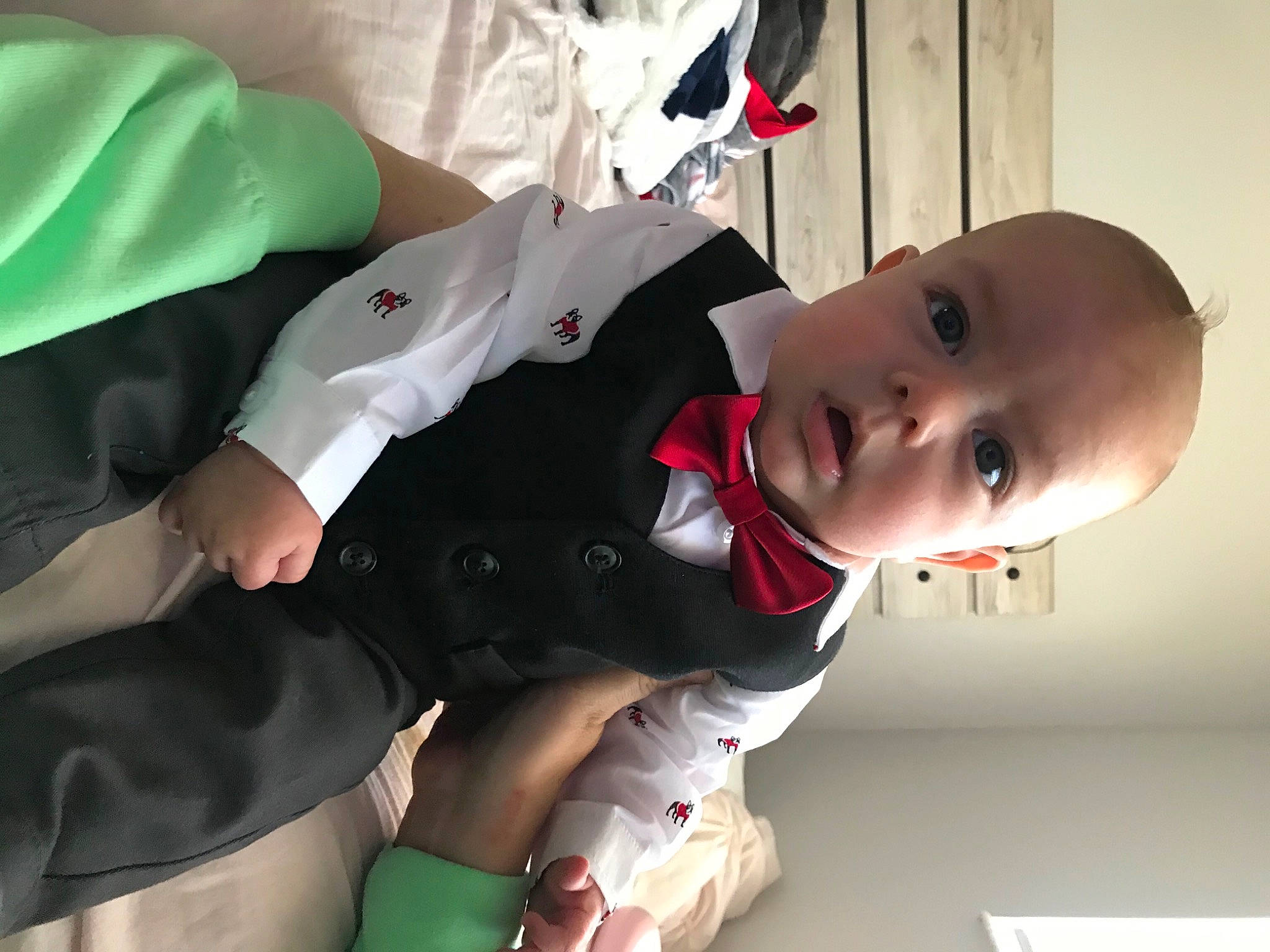 Kallum joined the competition — help win amazing prizes! baby, baby_products, baby_toddler_clothing, carmine, child, comfort, elbow, event, fictional_character, formal_wear, fun, gesture, happy, person, room, sitting, sleeve, suit, toddler, uniform