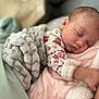 baby, sleeping, blanket, cozy, infant, peaceful, soft_texture, clothing, pink, gray, closeup, portrait, child, resting, cute, indoors, warm, comfort, newborn, peace