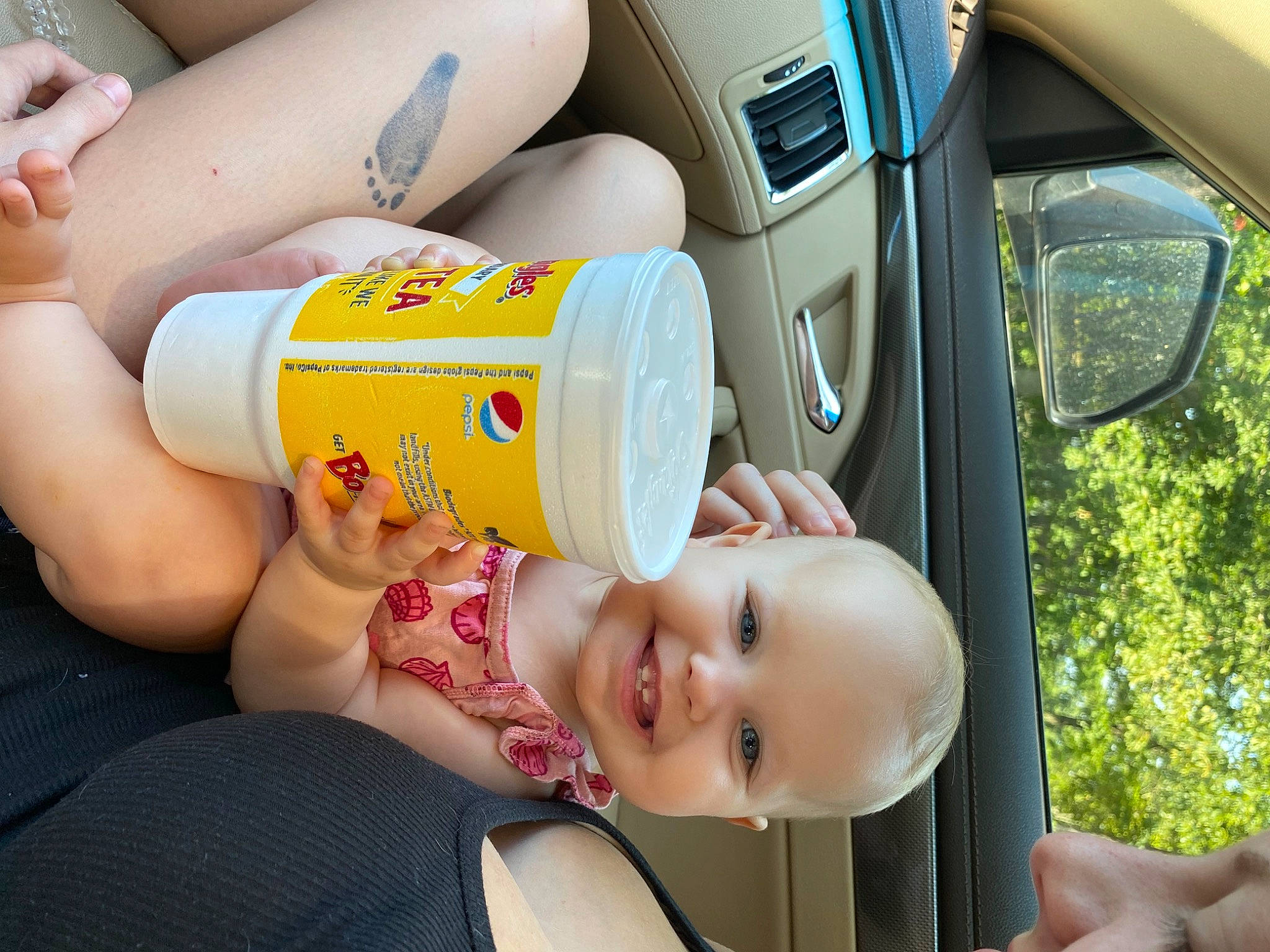 Alina is registered to the contest to win money with this photo: aluminum_can, automotive_lighting, baby, baby_products, child, drinkware, family_car, finger, fun, hand, happy, human_leg, joy, leisure, motor_vehicle, muscle, person, plastic_bottle, smile, thigh