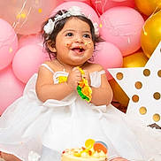 Nilly joined the competition — help win amazing prizes! baby, child, birthday, cake, smiling, white_dress, headband, balloons, pink, gold, celebration, happy, messy, party, decorations, polka_dot, star, sitting, indoor, cute