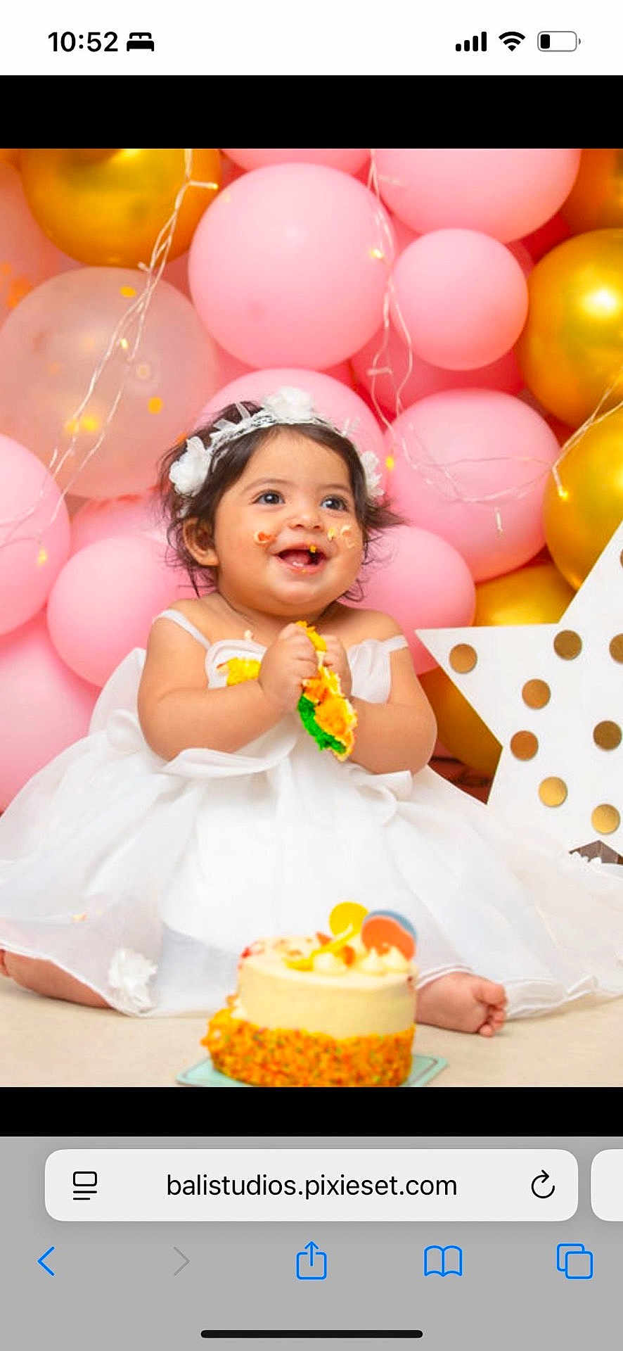 Nilly joined the competition — help win amazing prizes! baby, child, birthday, cake, smiling, white_dress, headband, balloons, pink, gold, celebration, happy, messy, party, decorations, polka_dot, star, sitting, indoor, cute