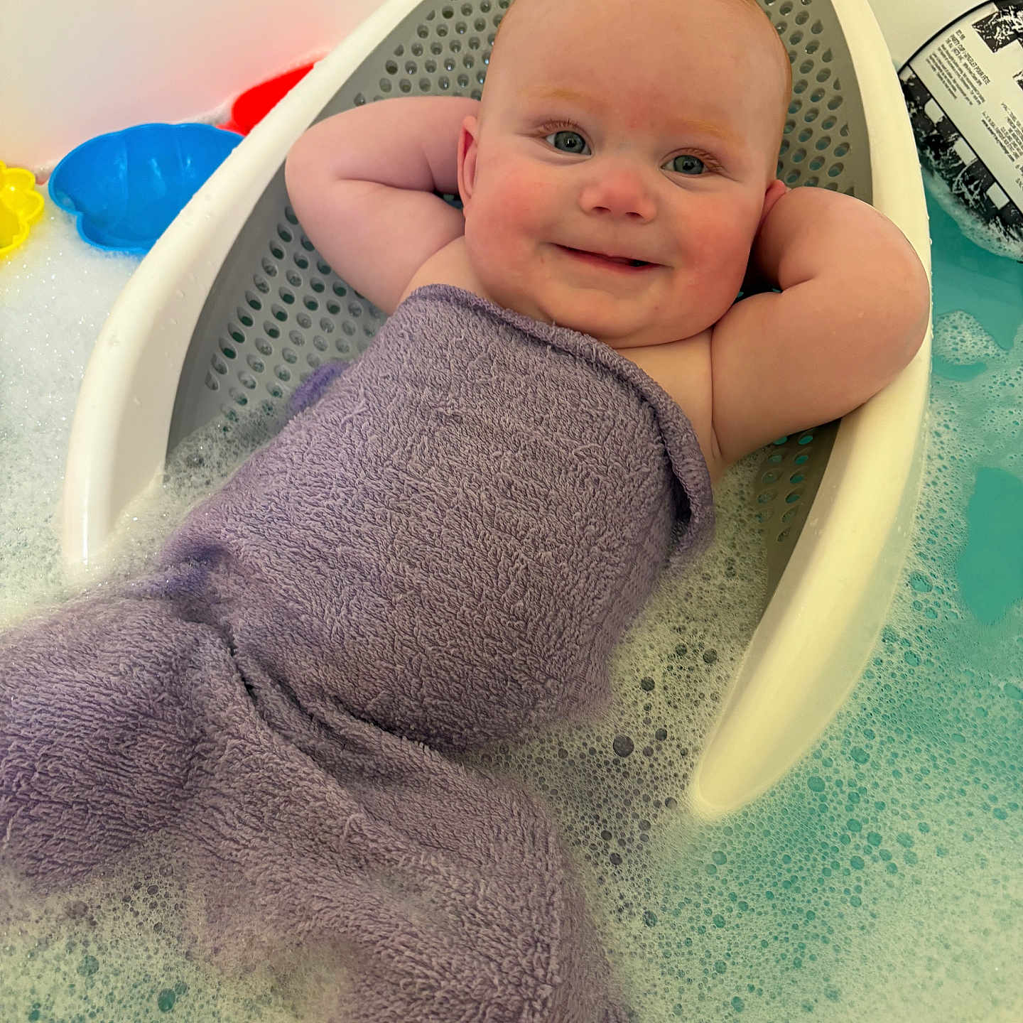 Tillie Kay joined the competition — help win amazing prizes! arms, baby, bath, bathtub, blue, bubble_bath, child, cute, foam, head, infant, mermaid_tail, purple_towel, relaxing, skin, smiling, towel, toy, water, white
