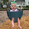 baby, child, swing, playground, headband, smile, happy, outdoor, woodchips, feet, clothing, person, park, fun, summer, daylight, residential, house, trees, metal