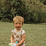 Leo joined the competition — help win amazing prizes! toddler, child, grass, outdoor, toy, onesie, lion_pattern, blonde_hair, nature, pond, greenery, summer, casual_clothing, baby, portrait, playing, young_child, curious, daylight, park