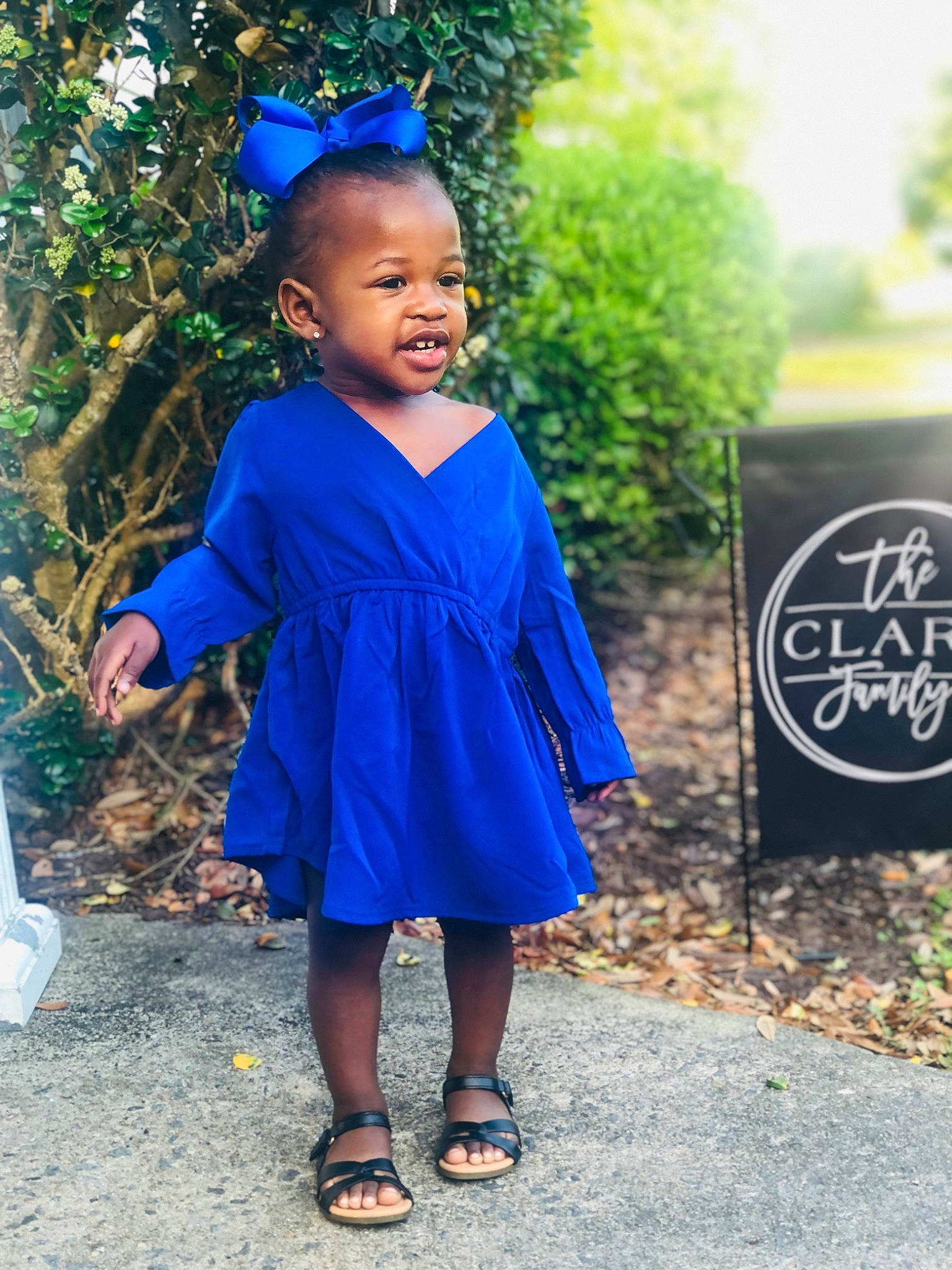 Blake joined the competition — help win amazing prizes! azure, baby_toddler_clothing, blue, clothing, day_dress, dress, electric_blue, fashion_design, formal_wear, grass, happy, headgear, jewellery, magenta, one_piece_garment, person, plant, sandal, sleeve, toddler