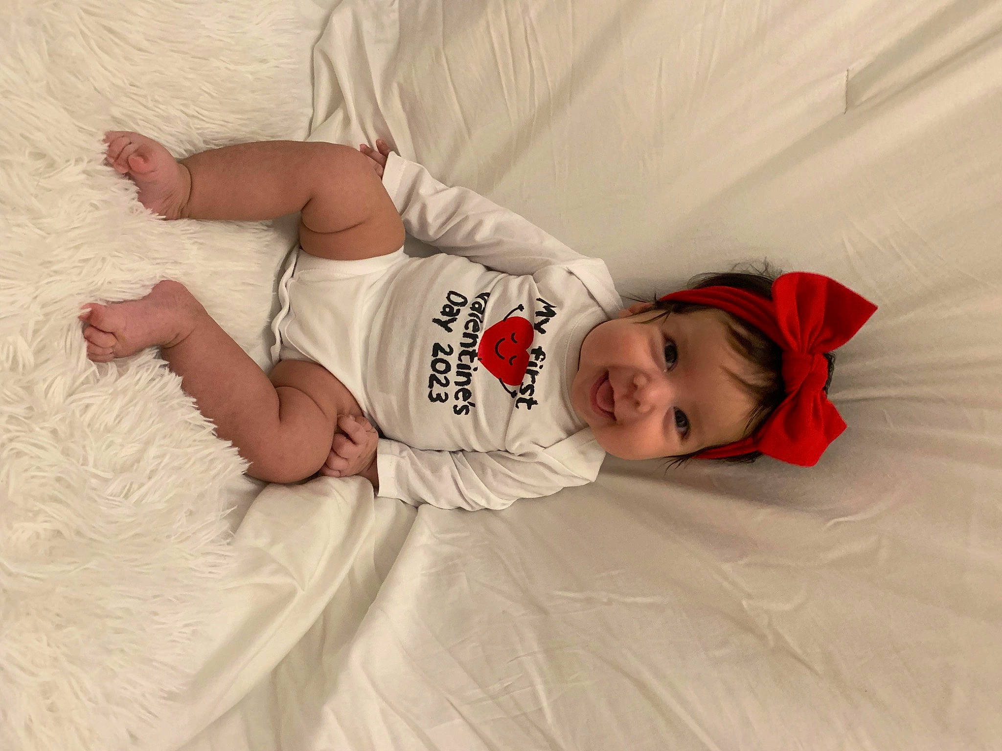 Lucia joined the competition — help win amazing prizes! baby, baby_toddler_clothing, bed, bedding, blond, child, comfort, elbow, flash_photography, happy, human_leg, joy, knee, leg, linens, person, skin, sleeve, textile, thigh