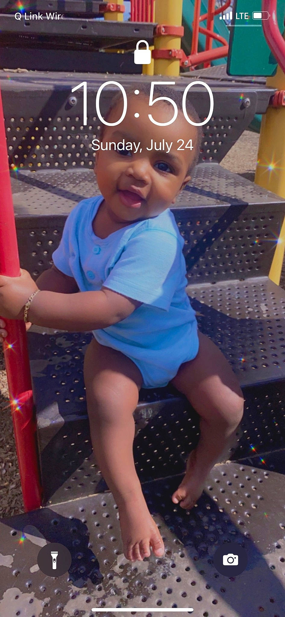 Calvin is registered to the contest to win money with this photo: baby_toddler_clothing, beauty, electric_blue, facial_expression, finger, fun, hairstyle, happy, headwear, human, human_body, human_leg, leisure, person, pink, public_space, sandal, standing, summer, t_shirt