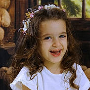 Anais participe au concours pour gagner de l'argent avec cette photo : child, girl, smiling, curly_hair, headband, white_shirt, teddy_bear, toy, indoor, portrait, happy, cute, childhood, decor, warm_lighting, face, person, playful, young, fun