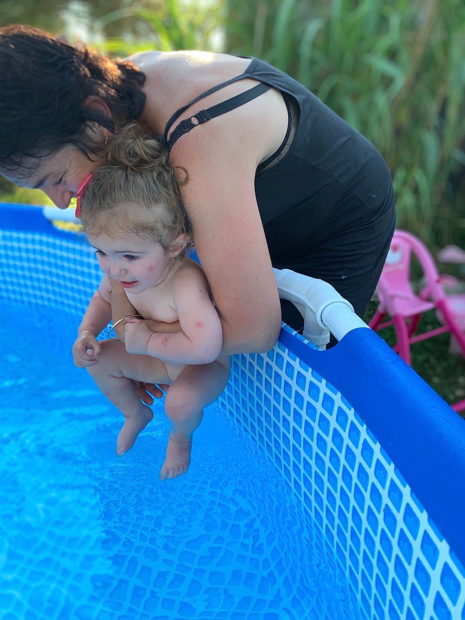 Lolena participe au concours pour gagner de l'argent avec cette photo : azure, baby, barefoot, bathing, chest, child, electric_blue, event, fun, grass, happy, leisure, people_in_nature, person, play, recreation, shorts, swimming_pool, thigh, toddler