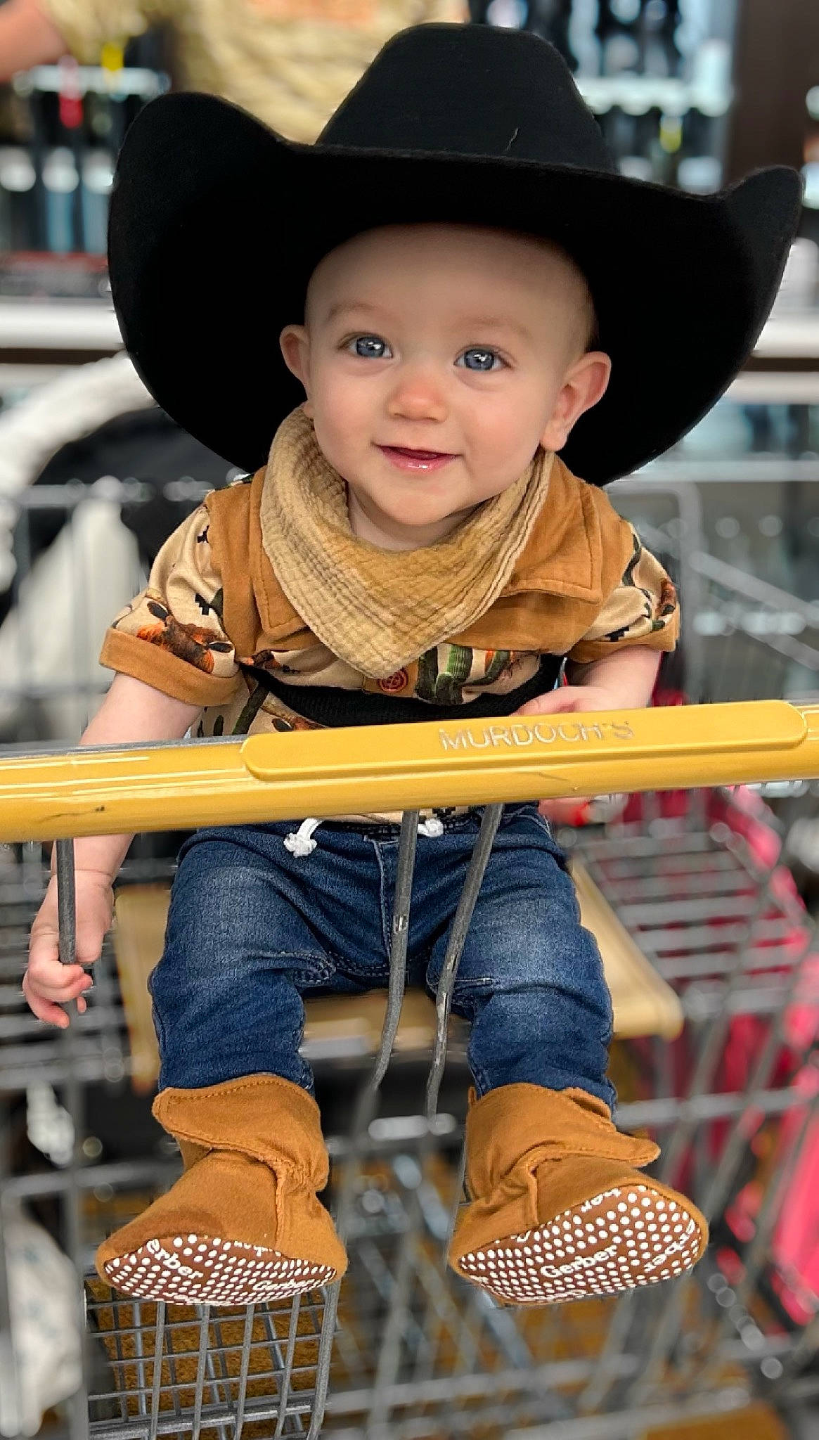 Maverick is registered to the contest to win money with this photo: baby, child, chin, clothing, facial_expression, fun, happy, hat, headwear, jeans, joy, leisure, organ, person, photograph, recreation, skin, smile, snapshot, sneakers